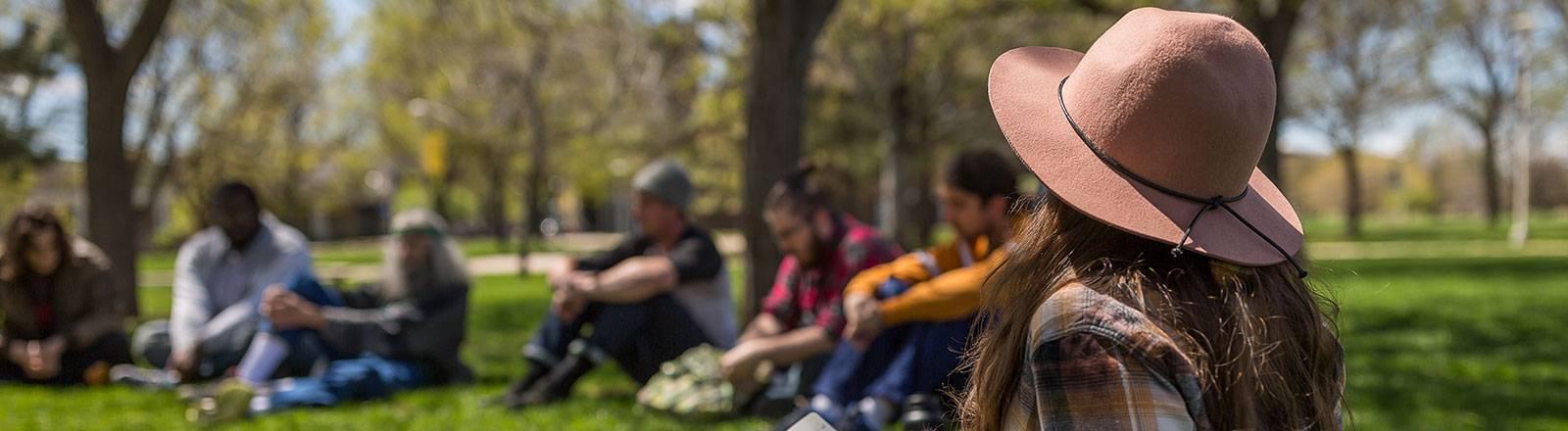 Student sitting in grass